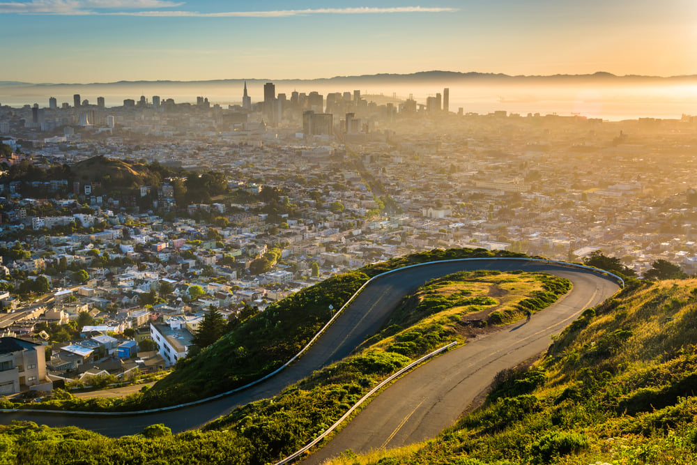 Curvy road and view of downtown at sunrise from Twin Peaks, in San Francisco, California.-1